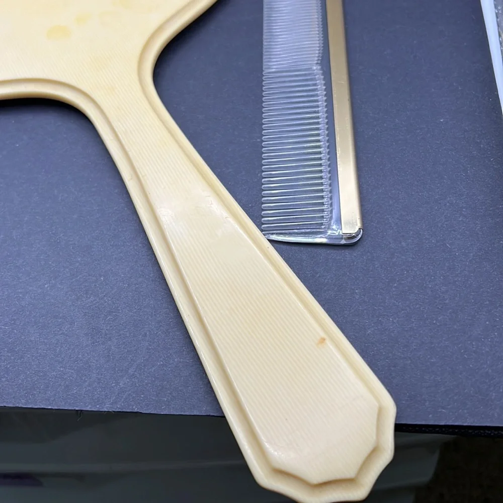 French Ivory 1950’s celluloid hand mirror and comb set
